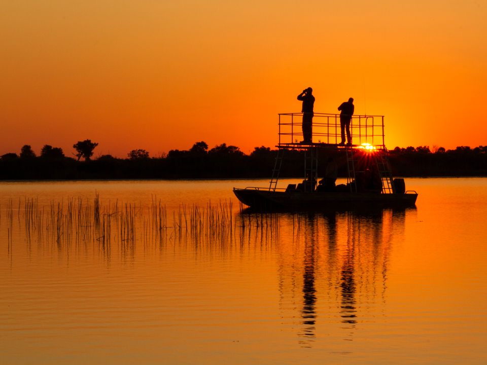 Zonsondergang in Okavango Kwara Camp, Botswana