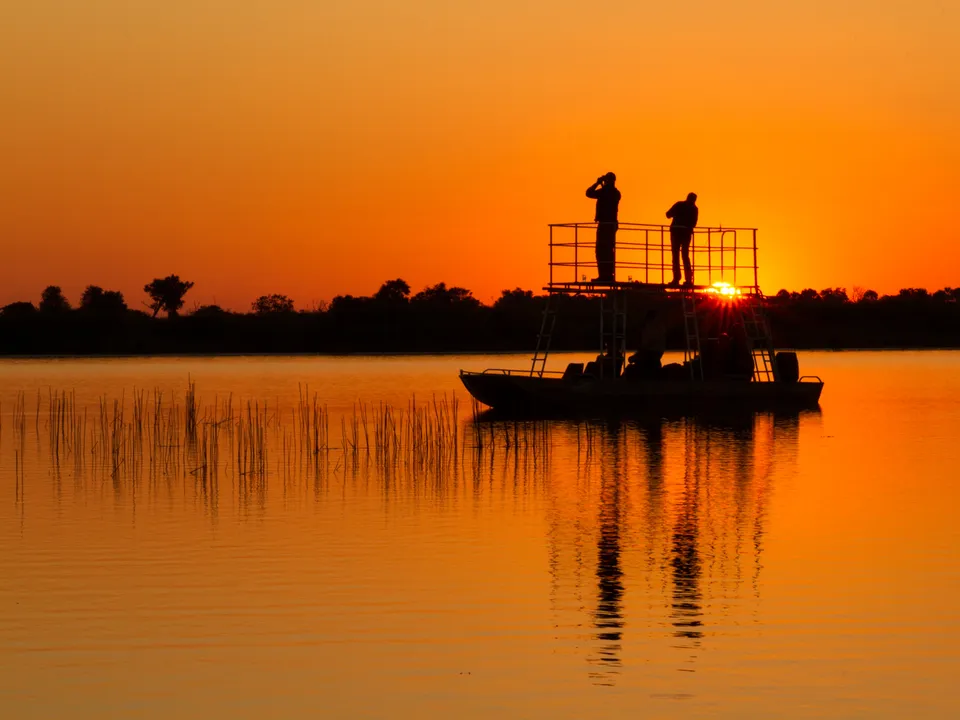 Zonsondergang in Okavango Kwara Camp, Botswana