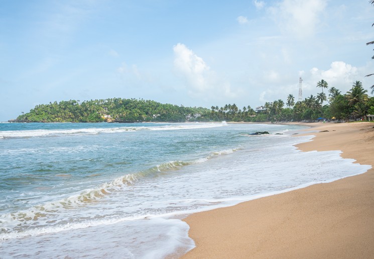 Een rustig strand, Arugam Bay in Sri Lanka