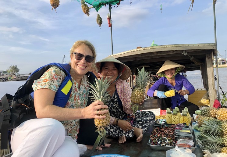 Verkopers op de boot in de Mekong Delta