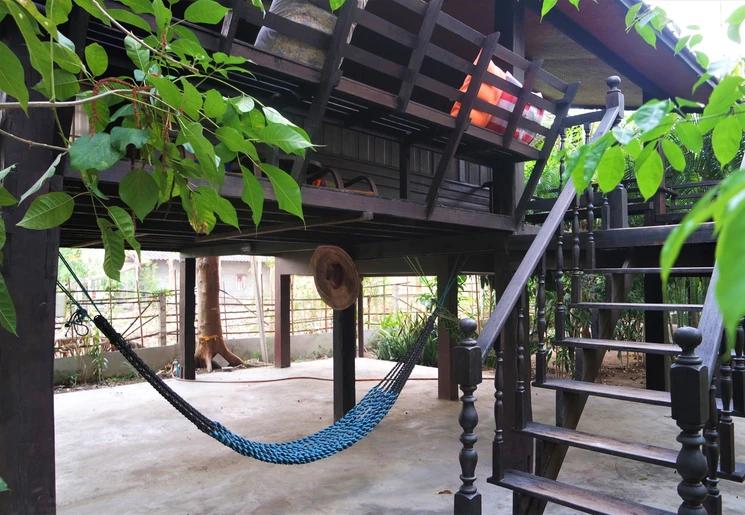 Kom tot rust in de hangmat bij de accommodatie Little Village, buiten Chiang Mai, Thailand Kom tot rust in de hangmat bij de accommodatie Little Village, buiten Chiang Mai, Thailand