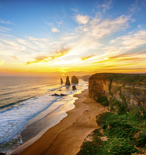 Bewonder de zonsondergang bij de Twaalf Apostelen, Australië